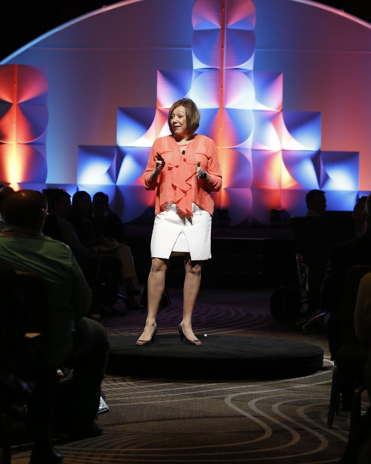 Jenn Garofolo speaking on stage during a Johnson and Johnson presentation