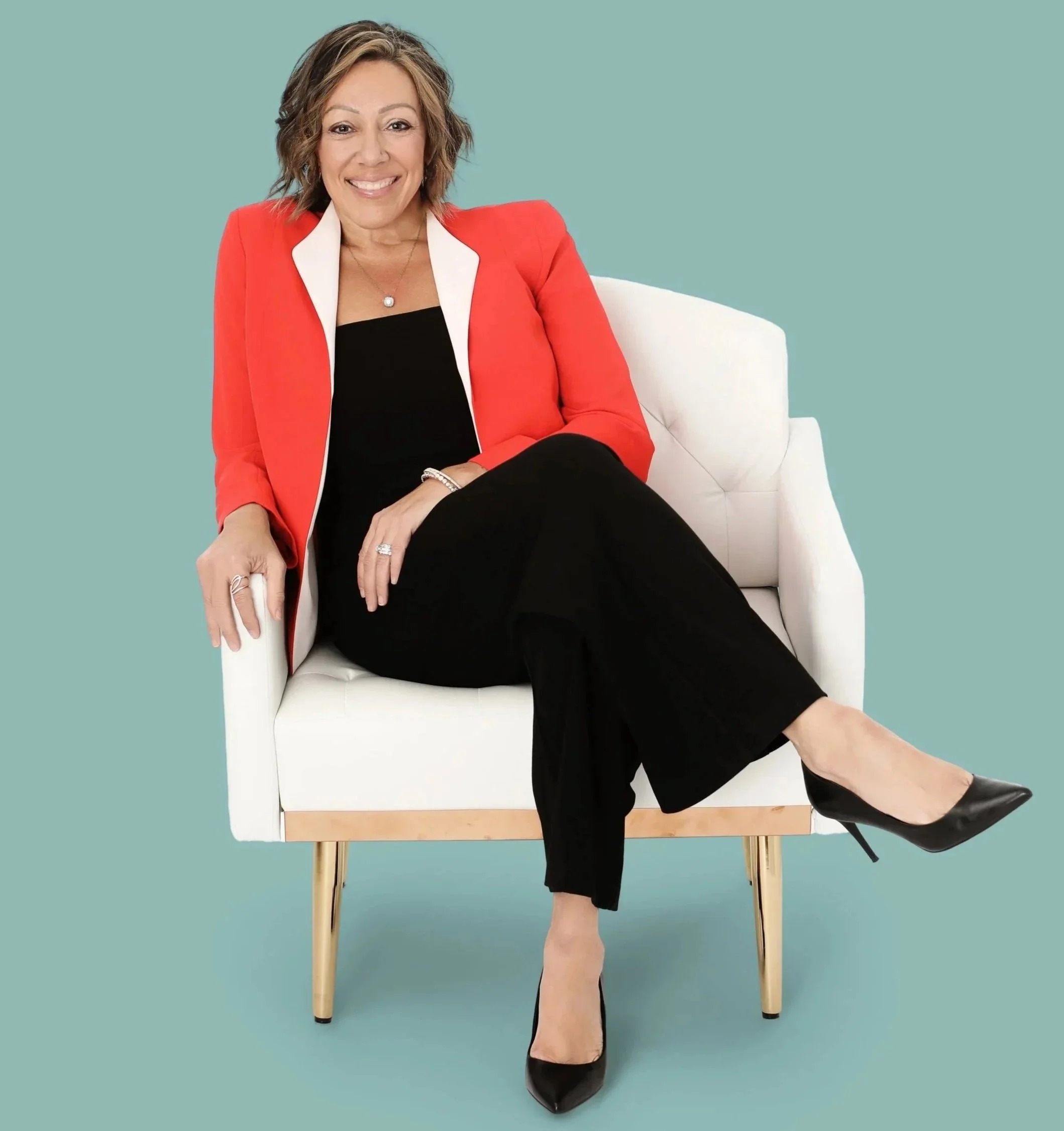 Jenn Garofolo seated, smiling in a professional portrait